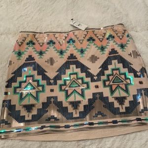 Brand new mini skirt accented with multicolored sequins